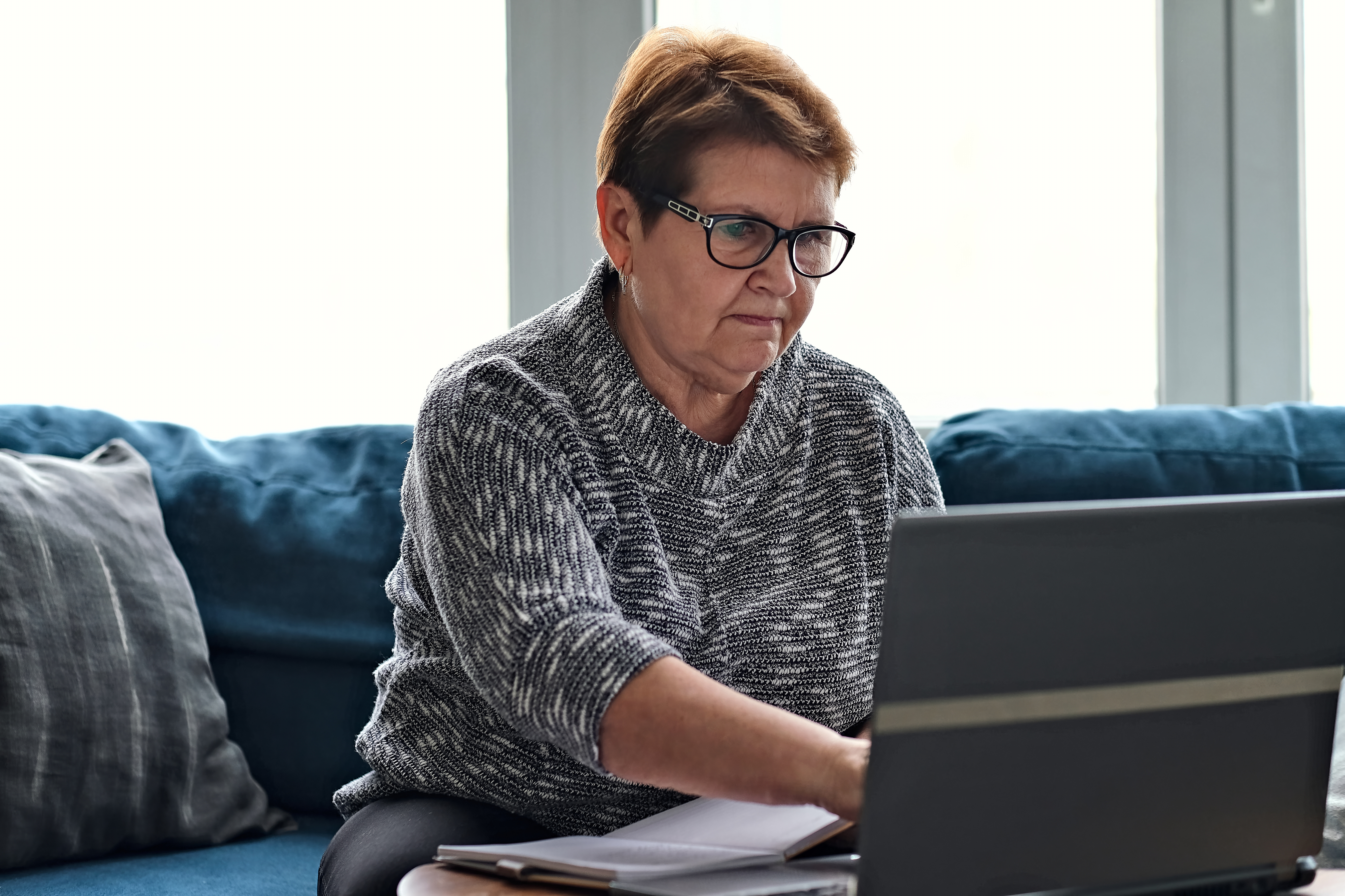 Older woman looking at her computer
