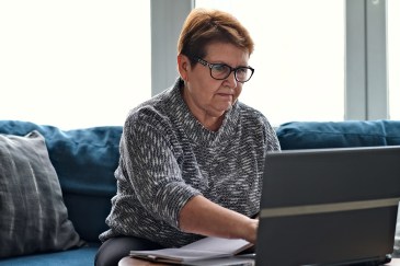Older woman looking at her computer