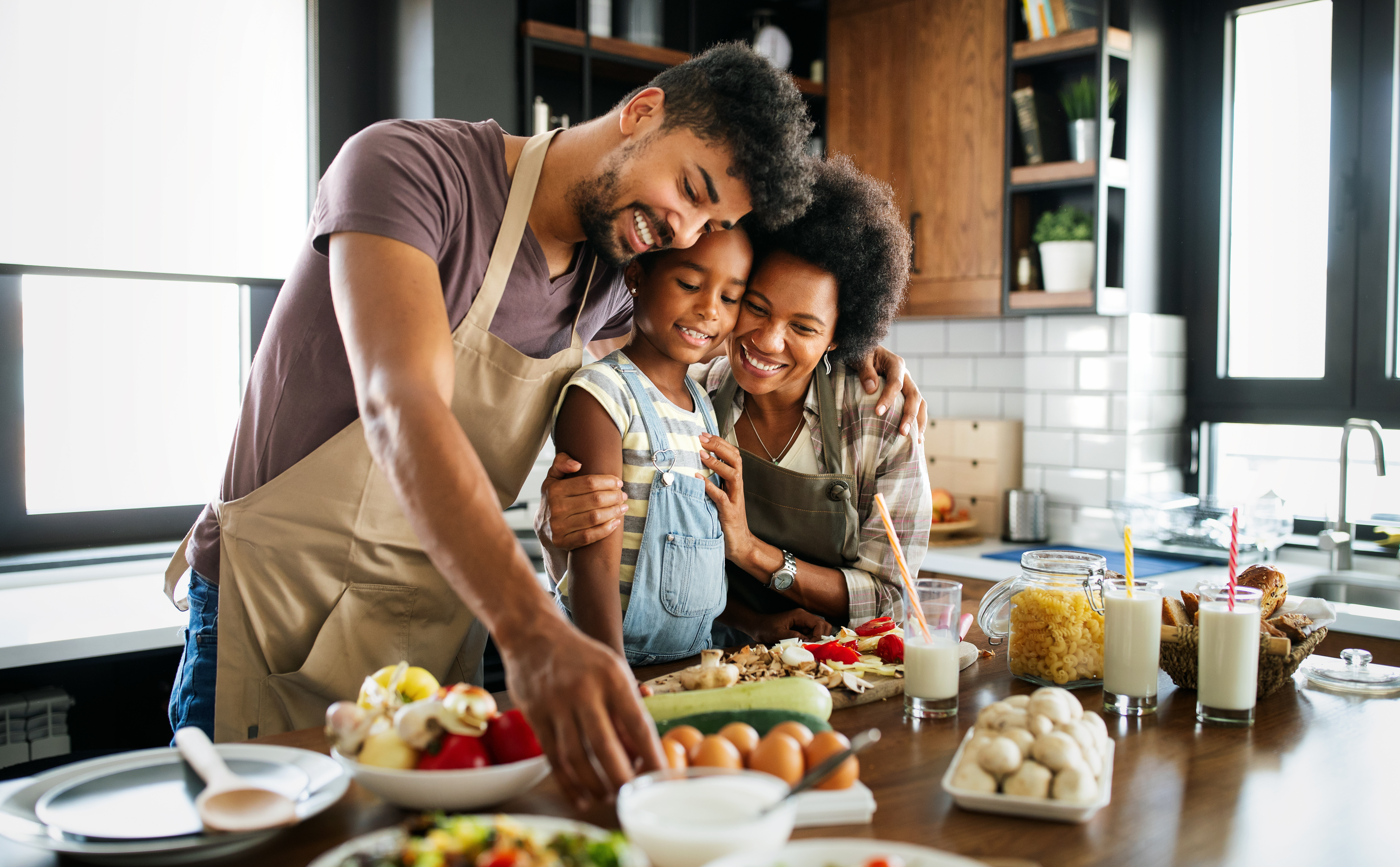 Family cooking healthy meal, dad, mom, daughter