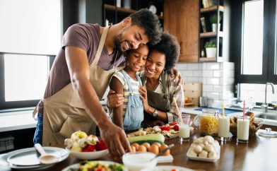 Family cooking healthy meal, dad, mom, daughter