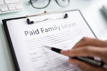 A sheet of paper that says: "Paid Family Leave."