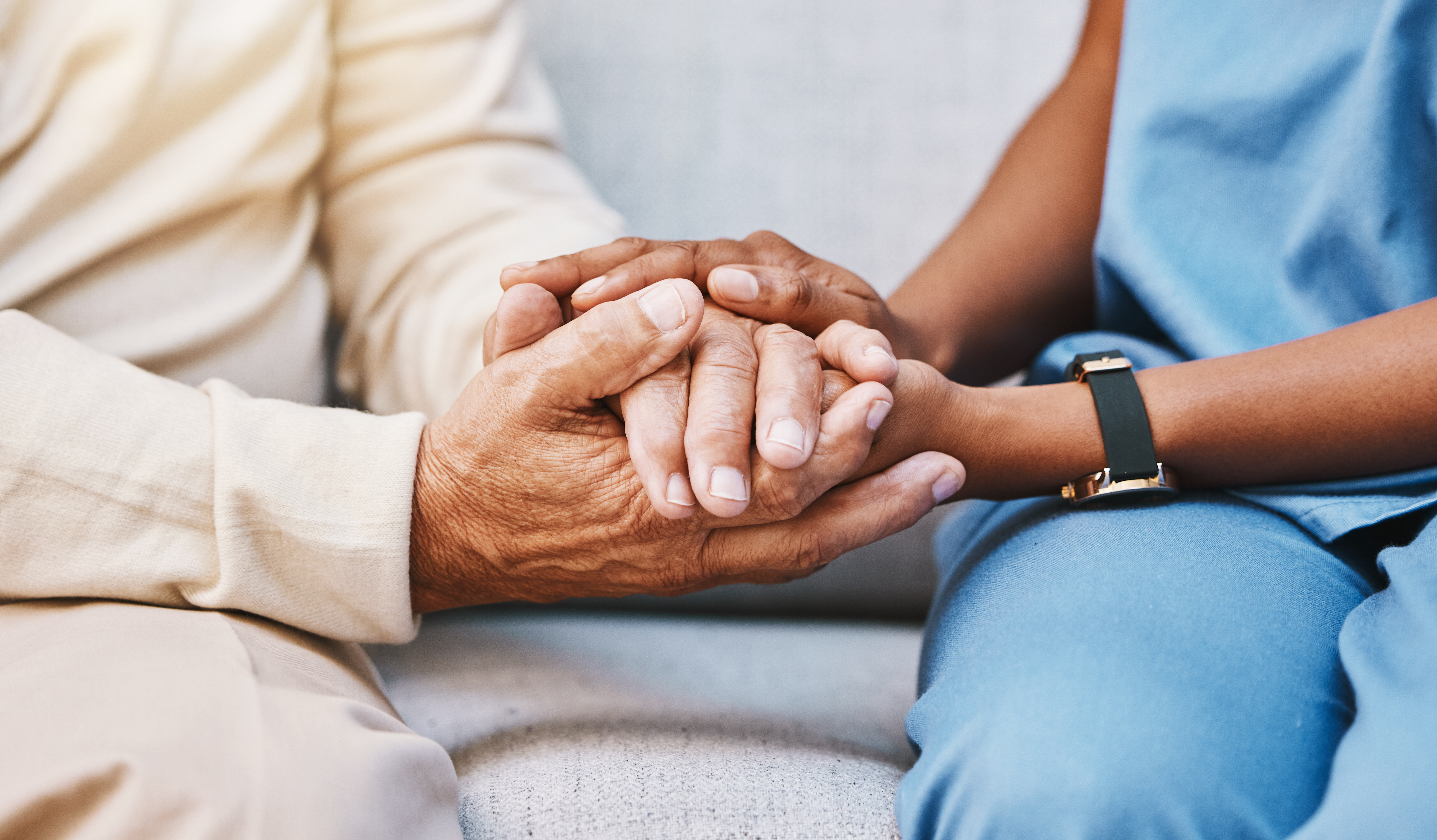 Nurse, hands and senior patient in empathy, safety and support of help, trust and healthcare consulting. Nursing home, counseling and gratitude for medical caregiver, client and hope in consultation.