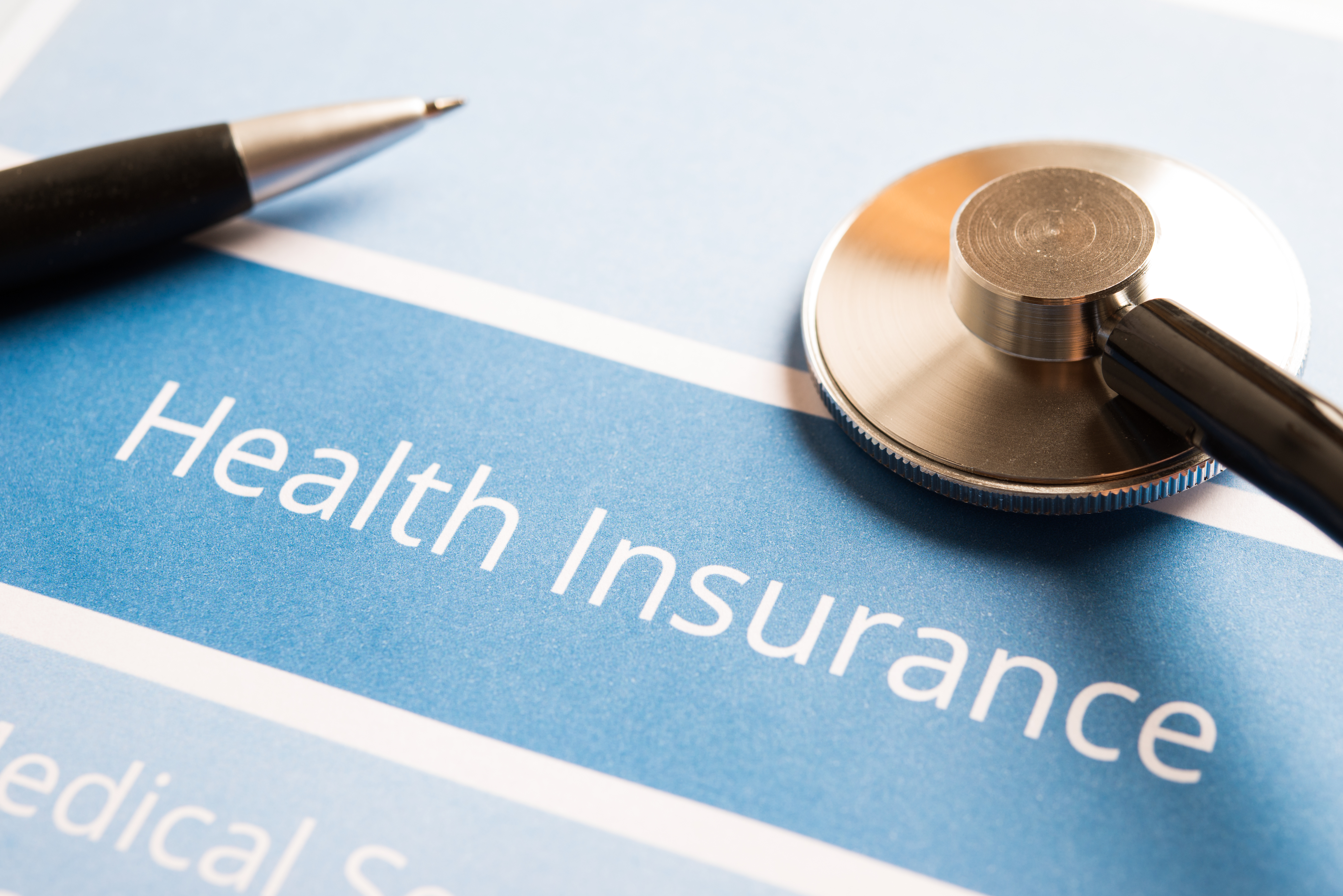 A sheet of paper that reads, "Health Insurance."