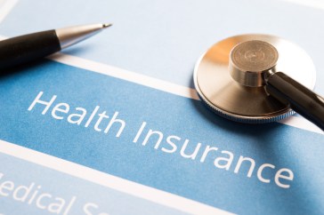 A sheet of paper that reads, "Health Insurance."