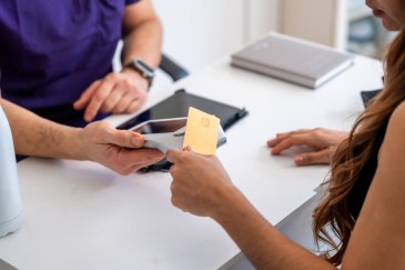 Woman paying at doctor's office