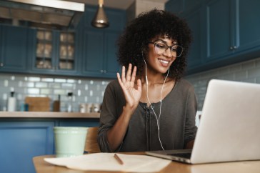Woman talking on video call on laptop