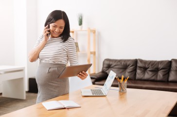 Pregnant woman in office