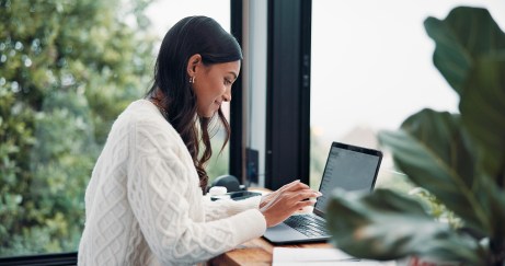 Woman, email or remote work in home with laptop for HR support, payroll or benefits administration.