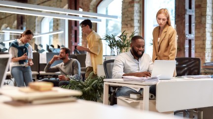 Group of employees working in office