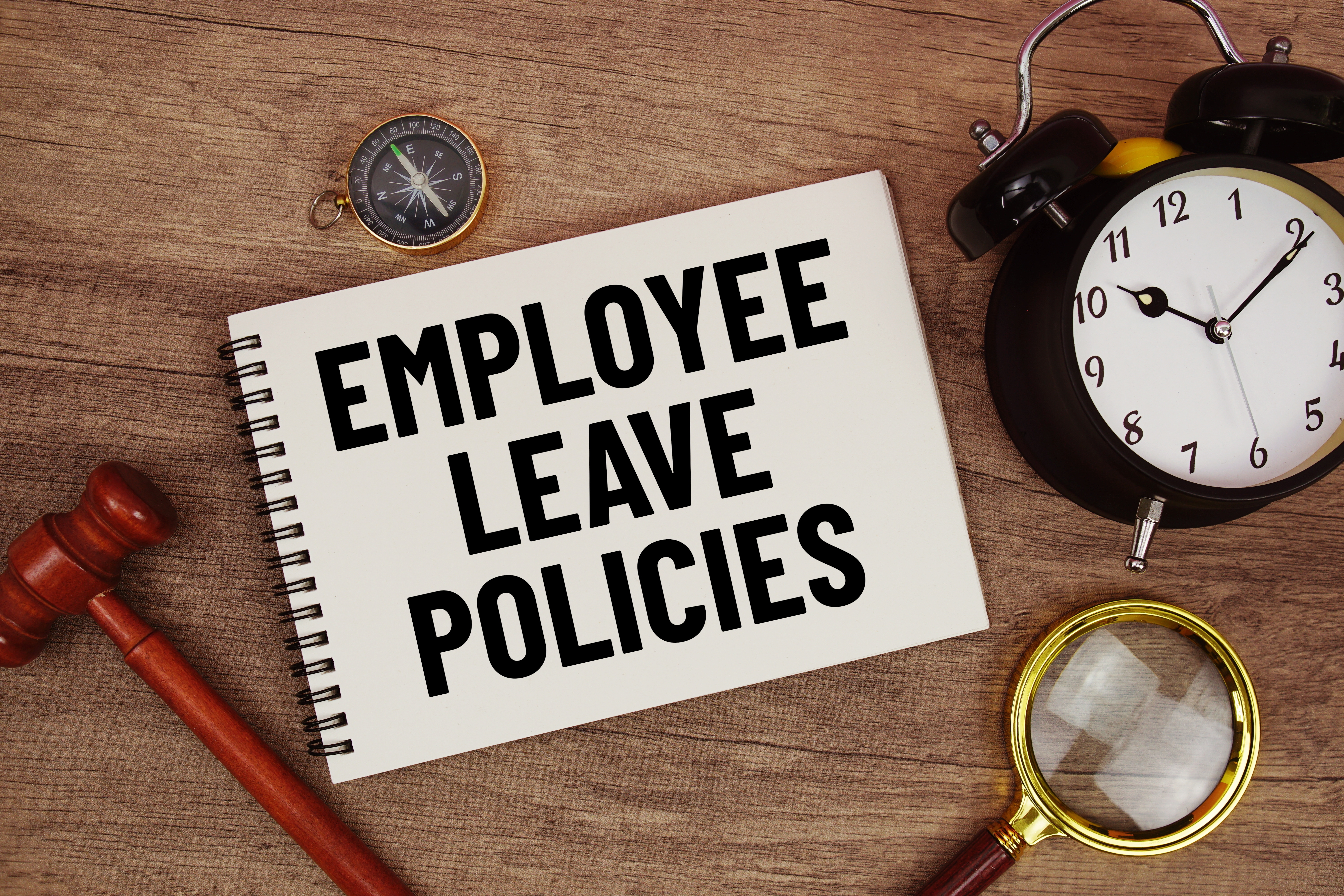 Employee leave policies notebook with legislation and time references