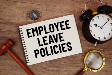 Employee leave policies notebook with legislation and time references