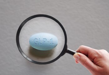 GLP-1 pill under magnifying glass