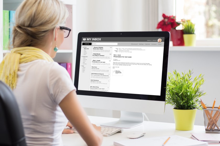 Woman checking email on computer