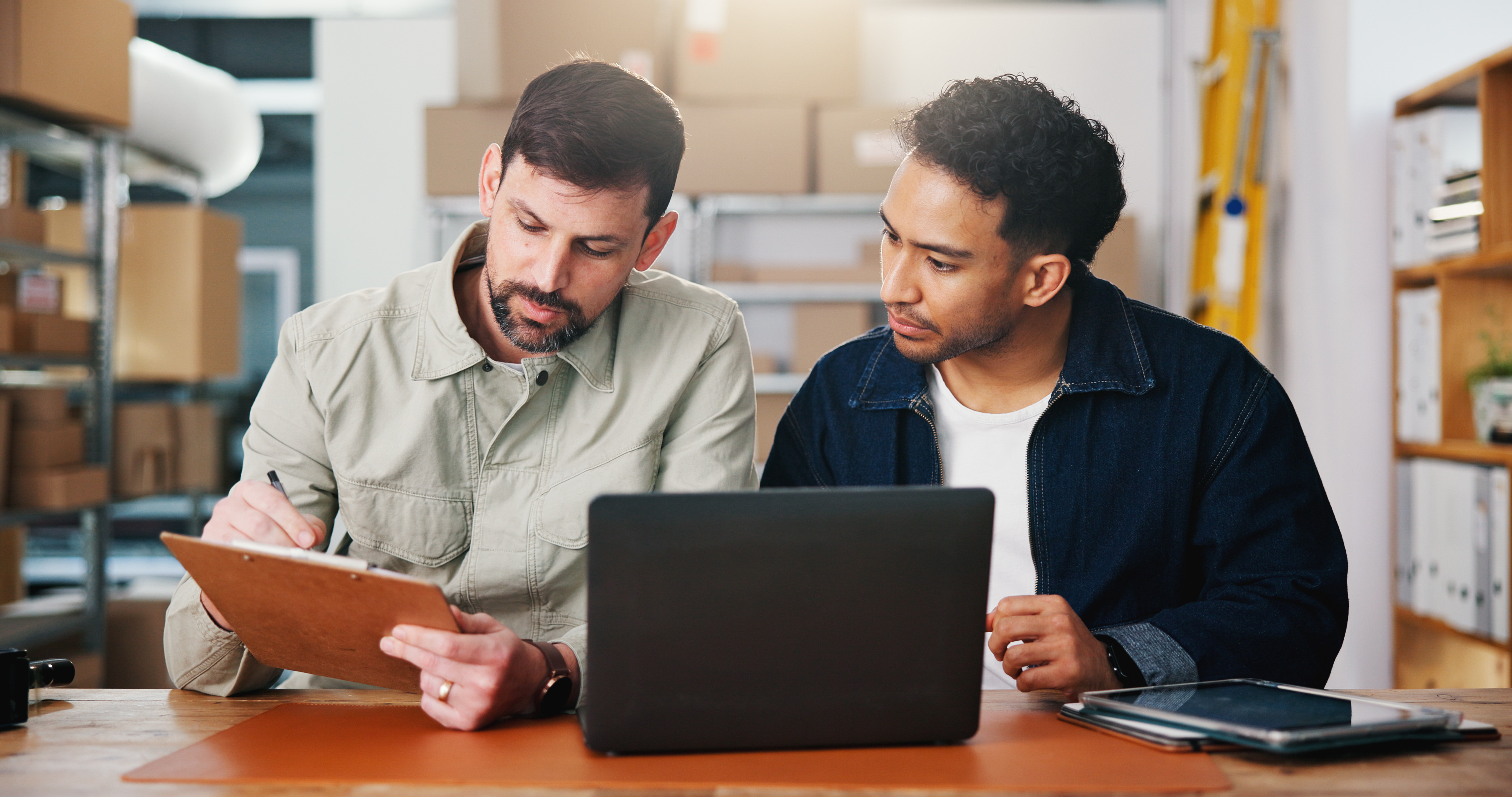 Review, checklist or people in office of small business, sales progress or parcel shipping for logistics. Check report, entrepreneur team or men planning for order fulfillment, delivery or stock info.