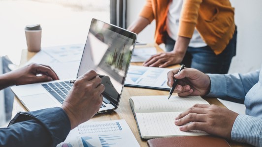 Business team meeting to conference, collaboration discussing working analyzing with financial data and marketing business strategy project, presentation and brainstorming to making profit of company.