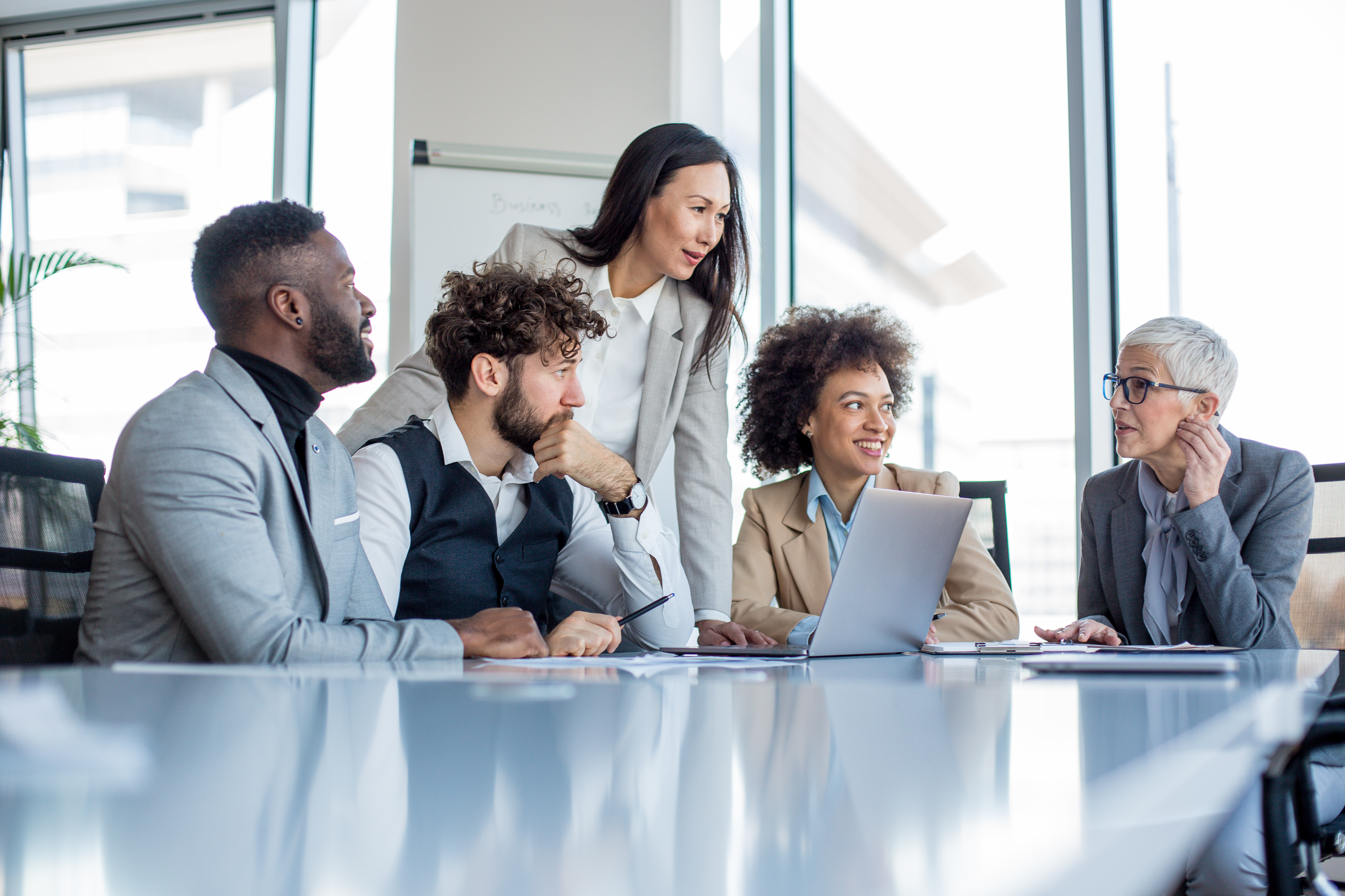Employees talking at table
