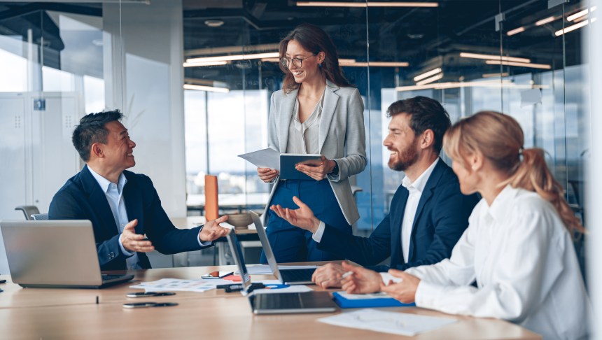 A group of business people partners during a set team meeting in the modern office.