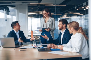 A group of business people partners during a set team meeting in the modern office.
