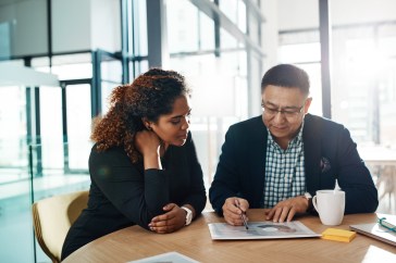 Meeting, finance and planning of people manager with graphs, charts and analysis, teamwork and collaboration. Business documents, financial report and accounting senior person, boss and leadership.