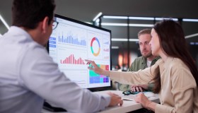 Businesswoman Managing Company Data Using Analytics Dashboard