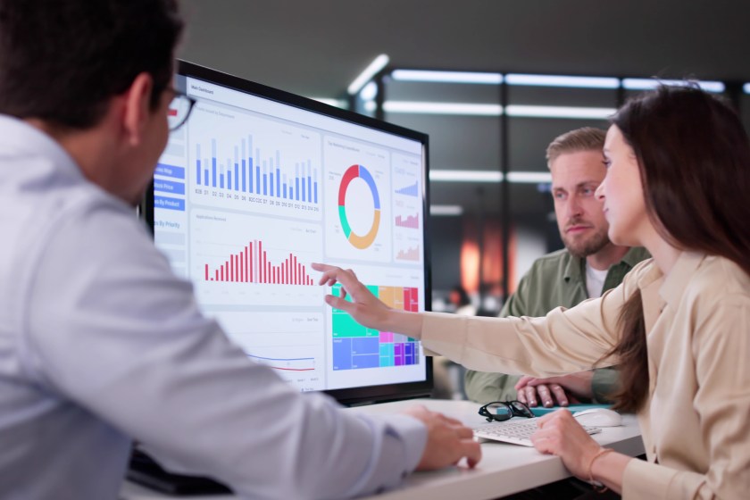 Businesswoman Managing Company Data Using Analytics Dashboard