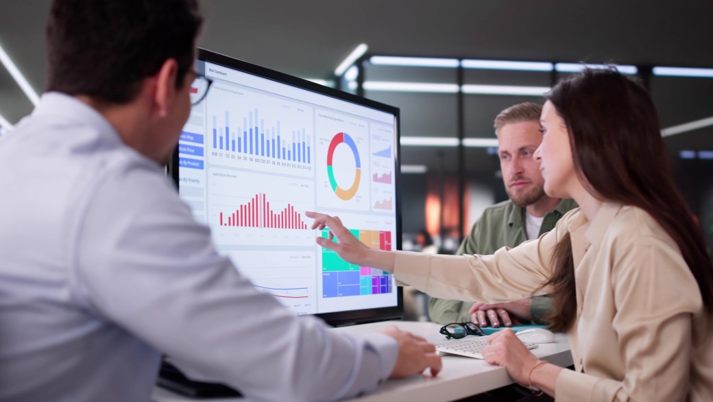 Businesswoman Managing Company Data Using Analytics Dashboard