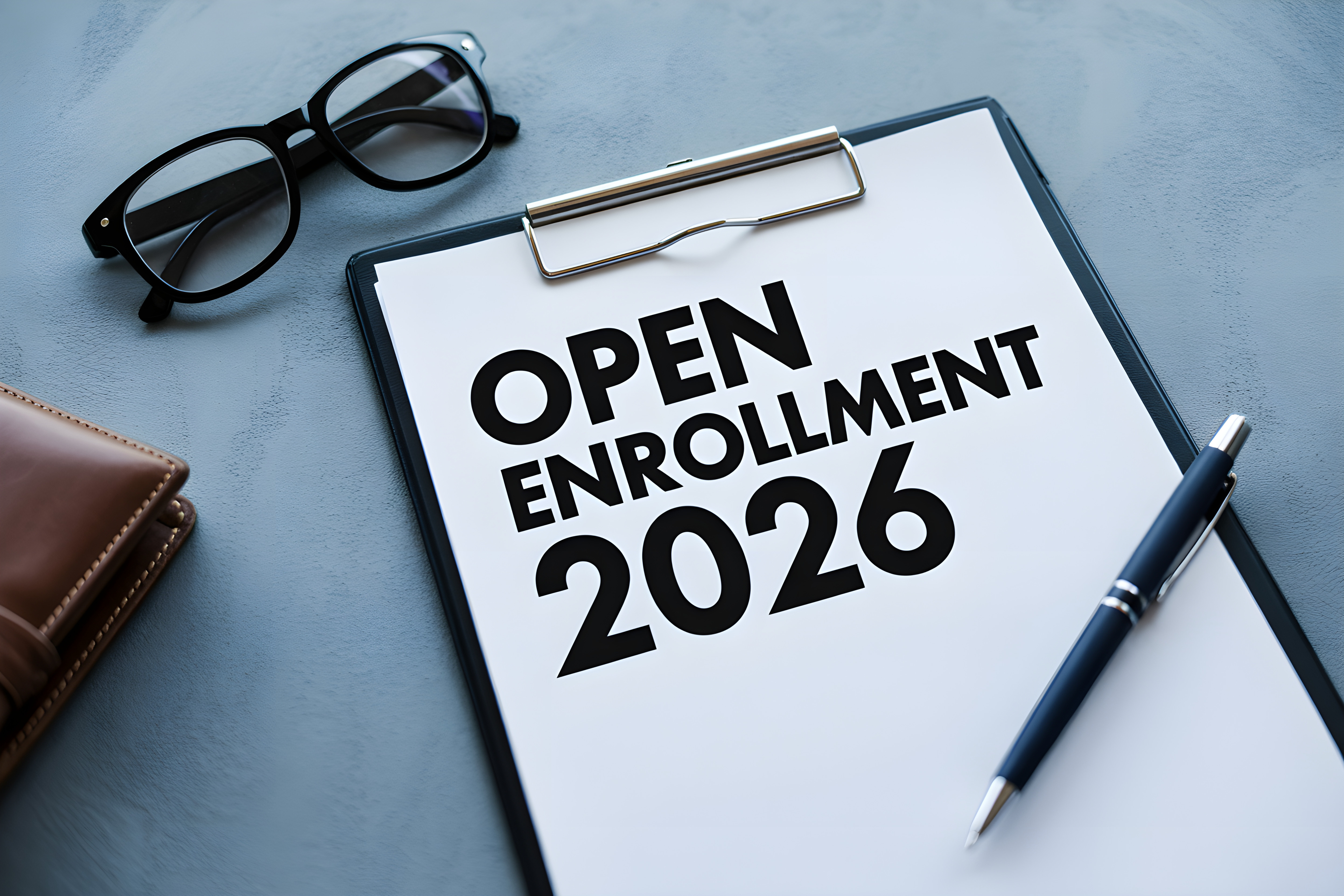 A sheet of paper that says, "Open Enrollment 2026."