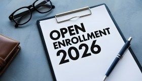 A sheet of paper that says, "Open Enrollment 2026."