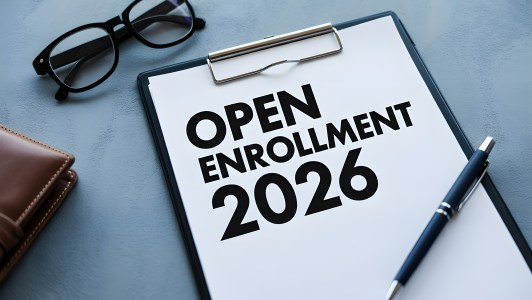 A sheet of paper that says, "Open Enrollment 2026."