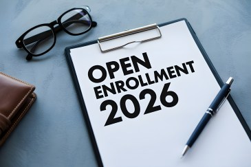 A sheet of paper that says, "Open Enrollment 2026."