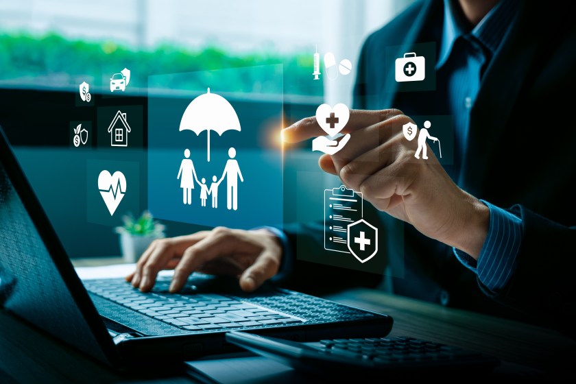 Digital insurance technology concept with businessman hand selecting family protection, health, finance, and retirement.