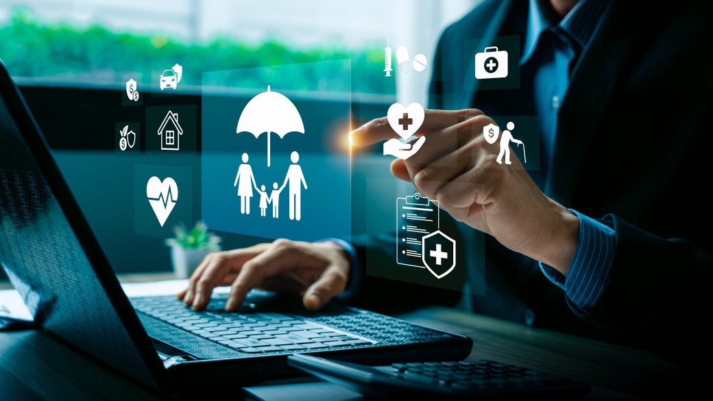 Digital insurance technology concept with businessman hand selecting family protection, health, finance, and retirement.