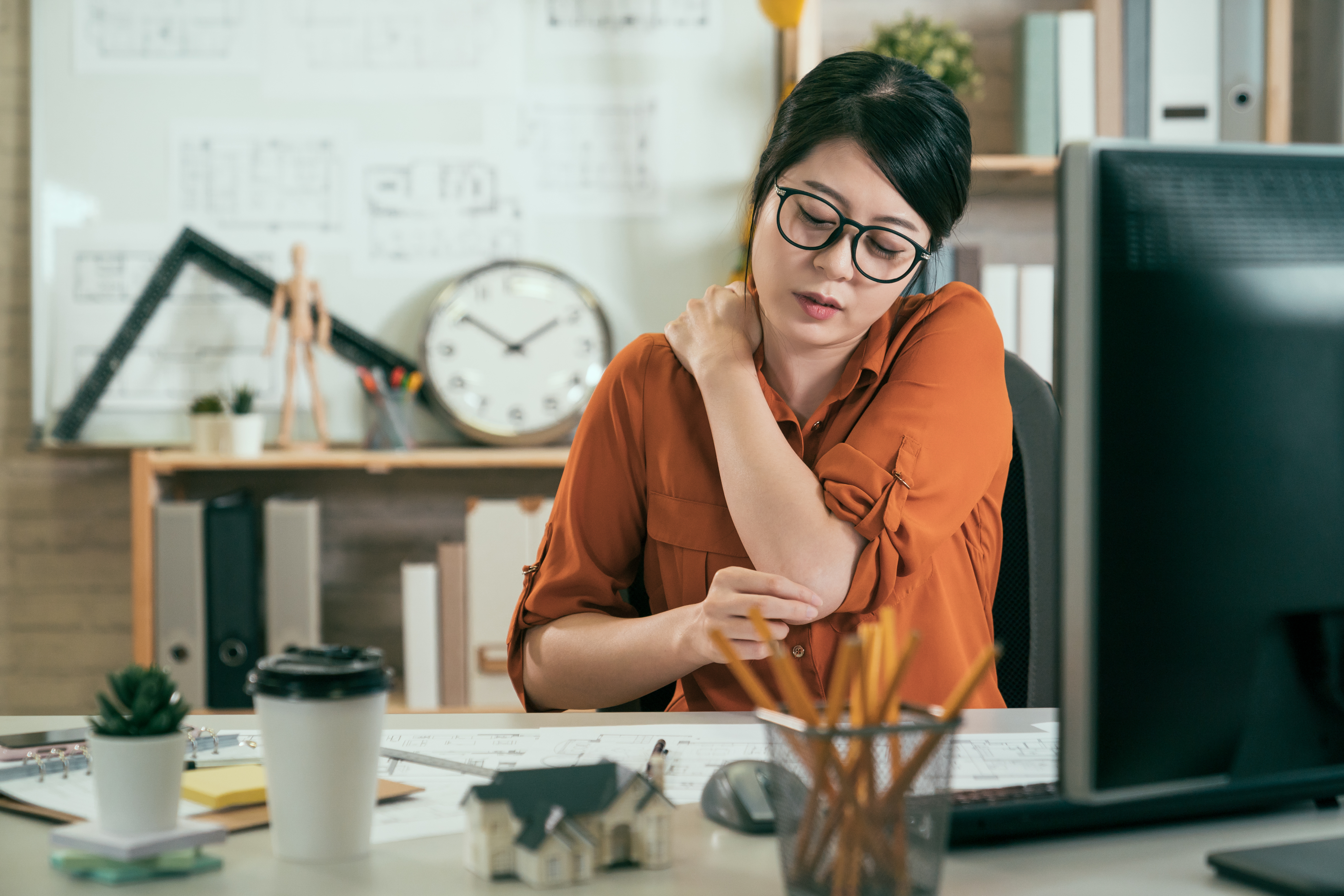 woman employee suffer shoulder pain