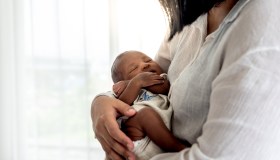 Portrait images of half African half Thai, 12-day-old baby newborn