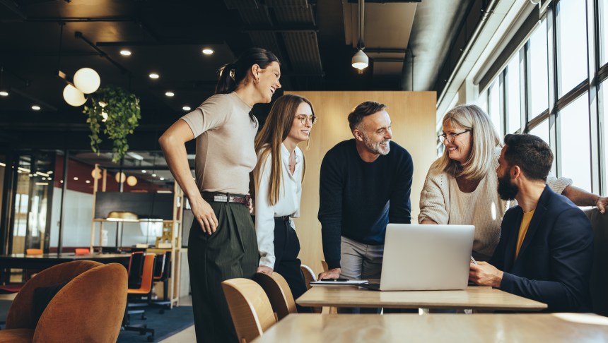 Smiling businesspeople having a discussion in an office