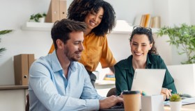Business people working with laptop and talking of they new project together in the office.
