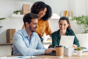 Business people working with laptop and talking of they new project together in the office.